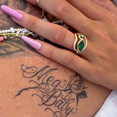 Meg's baby tatoo on the neck of Meg DeLacy's fiance, Brody Baker.